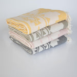 beach blanket picnic rug stack four colours
