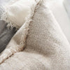 fringed linen cushion natural closeup