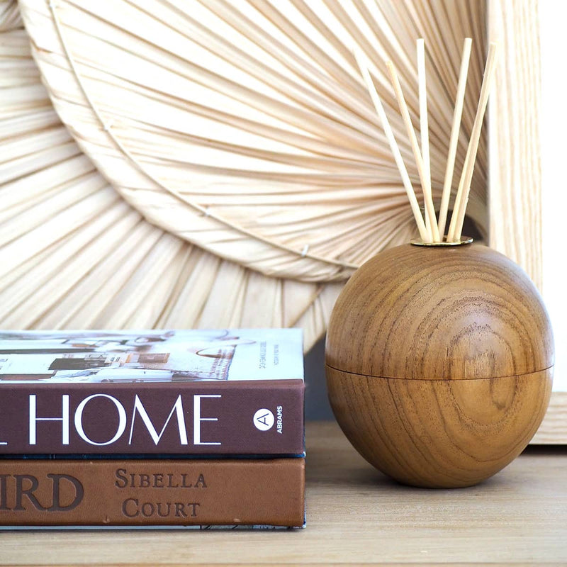 teak orb oil diffuser styled with books