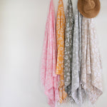 Turkish cotton towels styled on rattan wall hooks