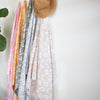 Turkish cotton towels styled on rattan wall hooks